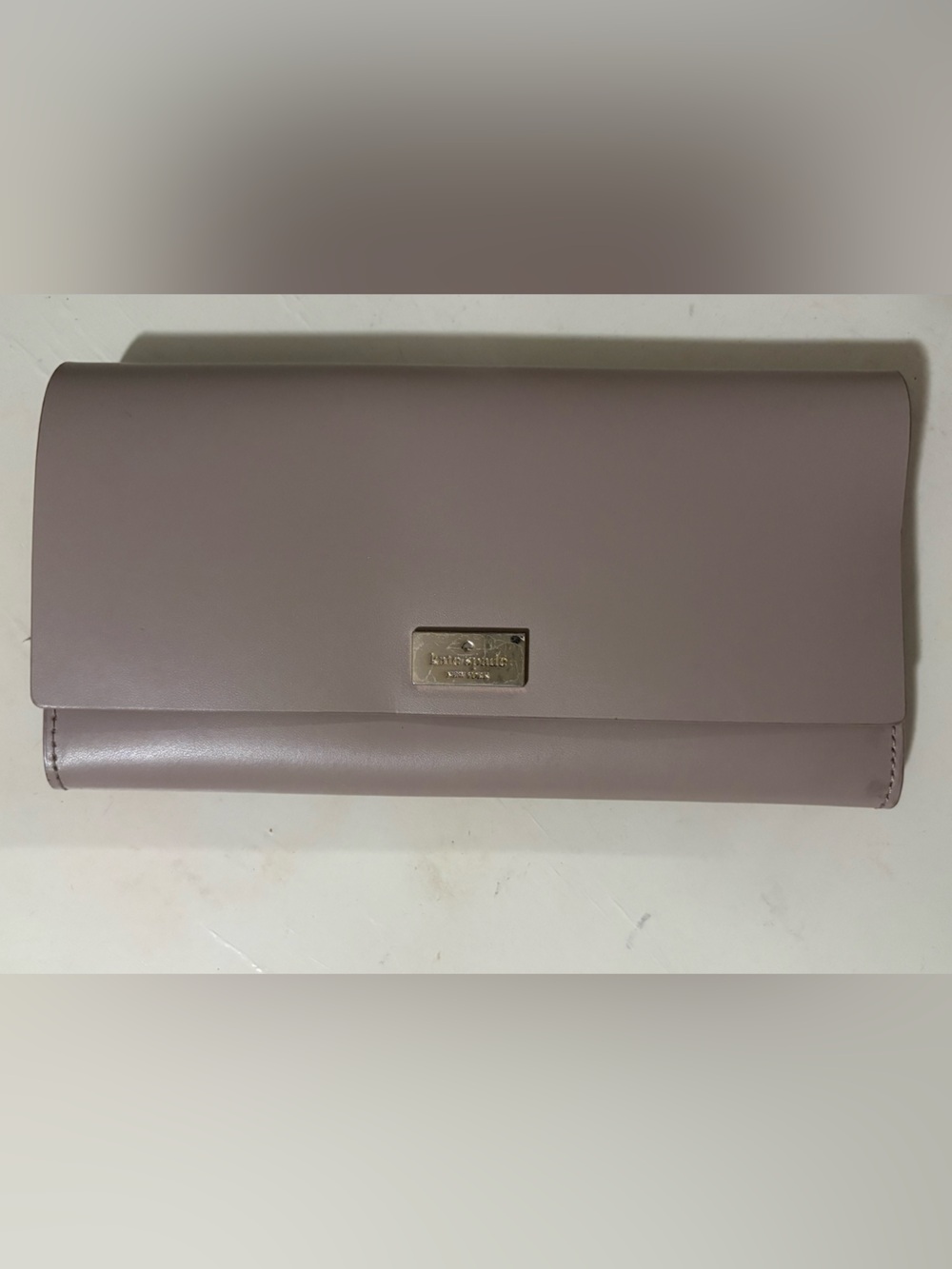 kate spade mauve leather continental wallet with gold plaque